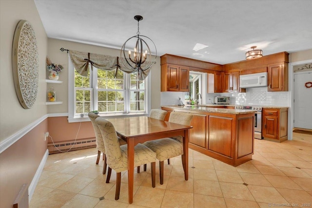 190 Bronson Dr, Middlebury, CT 06762 - dining room featuring baseboard heating, a chandelier, baseboards, and light tile patterned floors