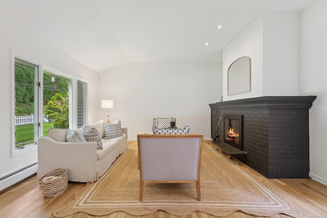 11 Valley Rd, Westport, CT 06880 - living room with baseboard heating, light wood-style flooring, a brick fireplace, lofted ceiling, and baseboards
