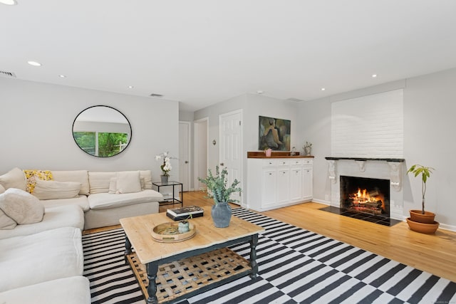 11 Valley Rd, Westport, CT 06880 - living room with light wood-type flooring, a fireplace, recessed lighting, and baseboards