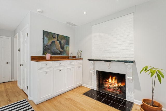 11 Valley Rd, Westport, CT 06880 - living area with light wood-style floors, a fireplace, recessed lighting, and baseboards