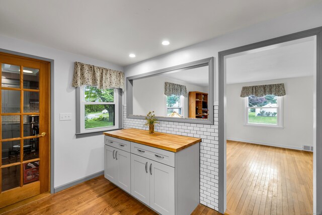 239 Old Field Ln, Milford, CT 06460 - kitchen with butcher block countertops, healthy amount of natural light, light wood-style flooring, and recessed lighting