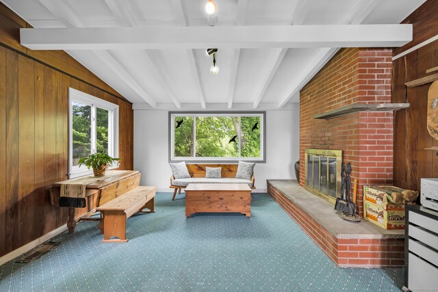 239 Old Field Ln, Milford, CT 06460 - carpeted living area featuring a fireplace and wooden walls