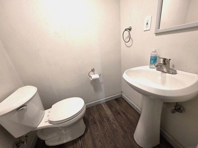 239 Old Field Ln, Milford, CT 06460 - bathroom with toilet, wood finished floors, and baseboards
