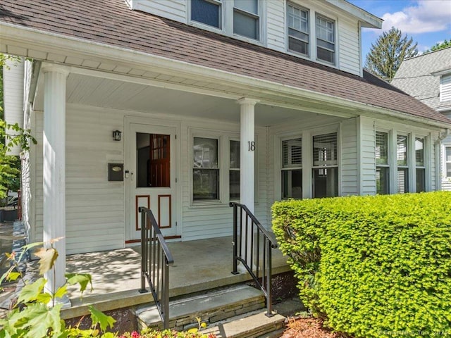 18 Geer Ave, Norwich, CT 06360 - view of exterior entry featuring a shingled roof and covered porch