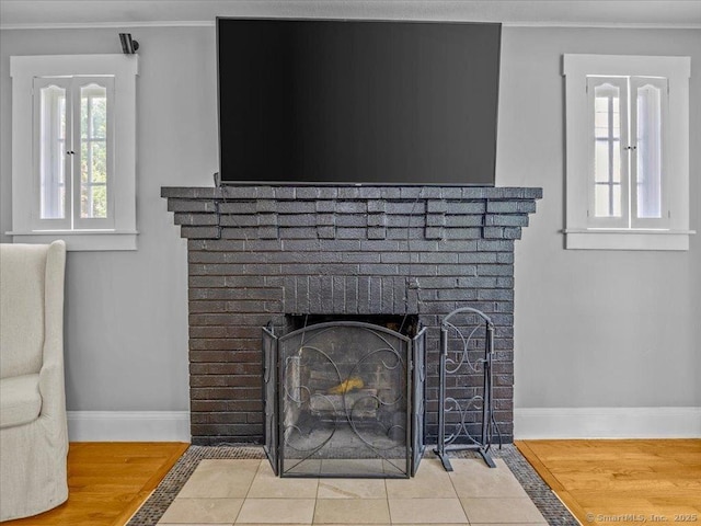 18 Geer Ave, Norwich, CT 06360 - detailed view of baseboards, a fireplace, and crown molding