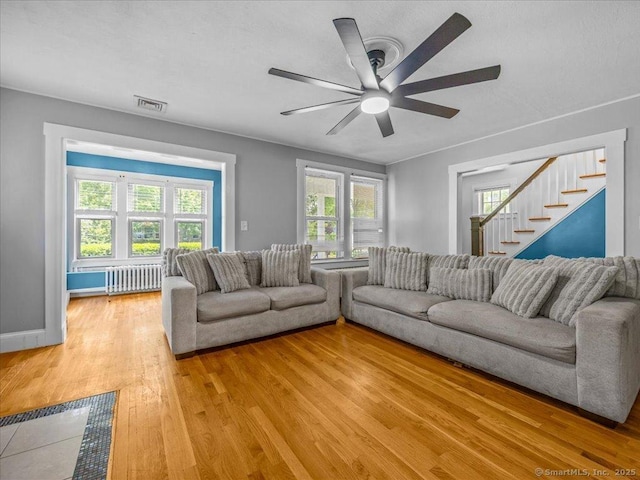 18 Geer Ave, Norwich, CT 06360 - living room with stairway, plenty of natural light, light wood-type flooring, and ceiling fan