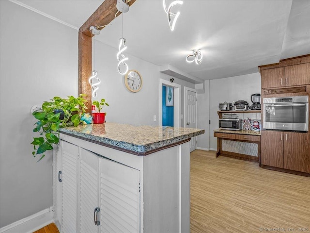 18 Geer Ave, Norwich, CT 06360 - kitchen featuring appliances with stainless steel finishes, a peninsula, light wood-style floors, and baseboards
