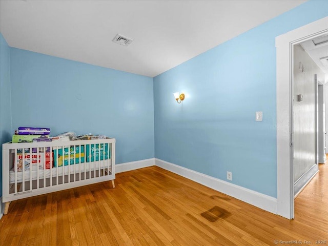 18 Geer Ave, Norwich, CT 06360 - bedroom featuring baseboards and wood finished floors