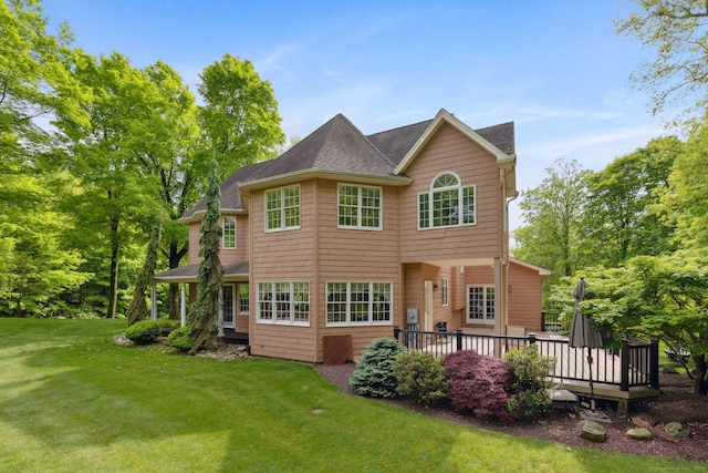 15 Ledge Rd, Southington, CT 06489 - back of property featuring a lawn, roof with shingles, and a deck