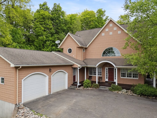 15 Ledge Rd, Southington, CT 06489 - traditional-style house featuring an attached garage, a shingled roof, driveway, and a porch