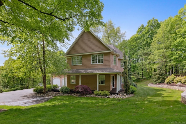15 Ledge Rd, Southington, CT 06489 - view of front facade with a porch, a front lawn, a garage, and driveway