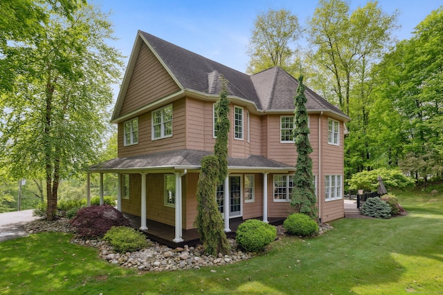15 Ledge Rd, Southington, CT 06489 - view of property exterior with covered porch, a yard, and a shingled roof