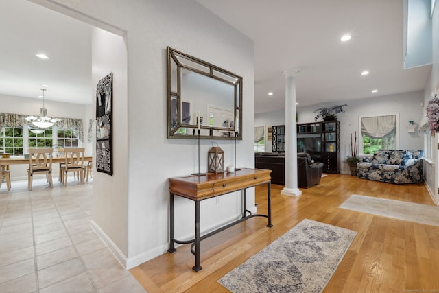 15 Ledge Rd, Southington, CT 06489 - hallway with ornate columns, wood finished floors, recessed lighting, baseboards, and a chandelier