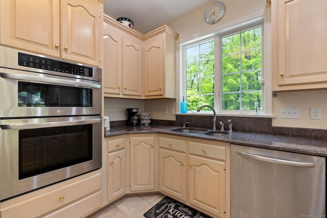 15 Ledge Rd, Southington, CT 06489 - kitchen with appliances with stainless steel finishes, a sink, dark countertops, and light tile patterned flooring