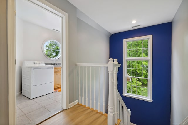 15 Ledge Rd, Southington, CT 06489 - corridor with washer / clothes dryer, an upstairs landing, a sink, and baseboards