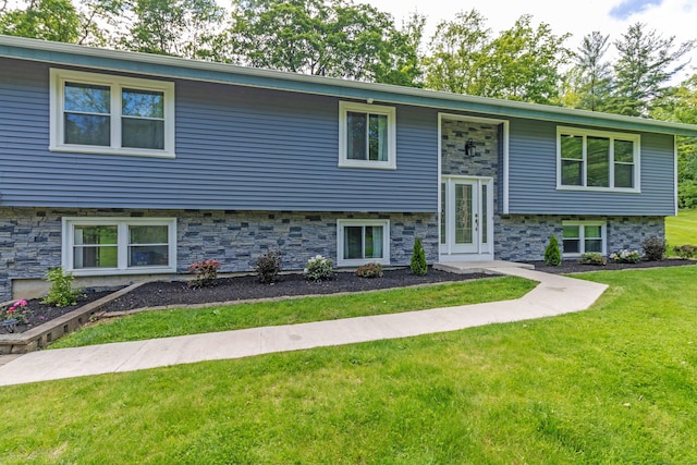55 Linton St, Torrington, CT 06790 - raised ranch featuring a front lawn and stone siding