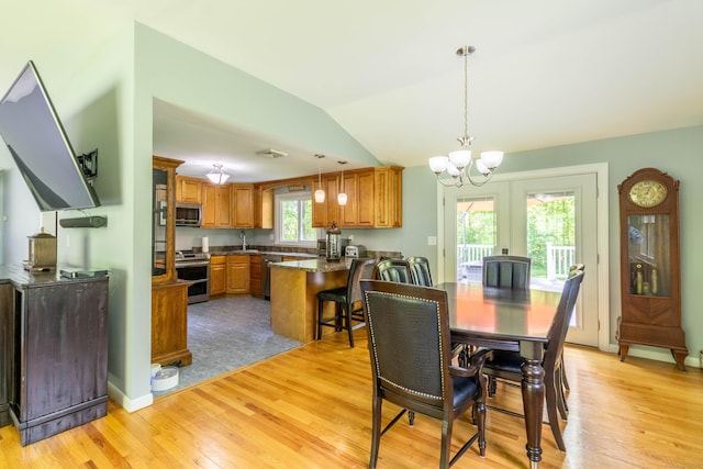 55 Linton St, Torrington, CT 06790 - dining area with light wood-style flooring, a chandelier, and vaulted ceiling