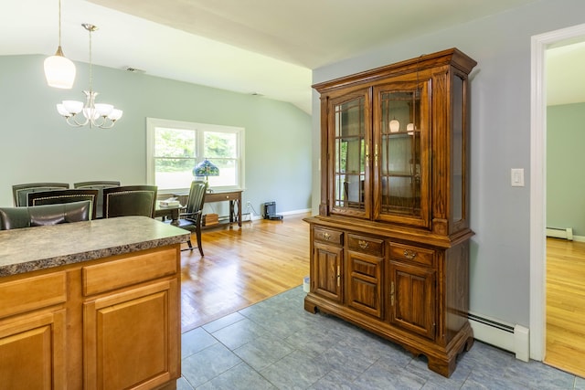 55 Linton St, Torrington, CT 06790 - kitchen featuring a baseboard radiator, a chandelier, hanging light fixtures, lofted ceiling, and glass insert cabinets