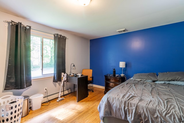 55 Linton St, Torrington, CT 06790 - bedroom with baseboard heating and wood finished floors