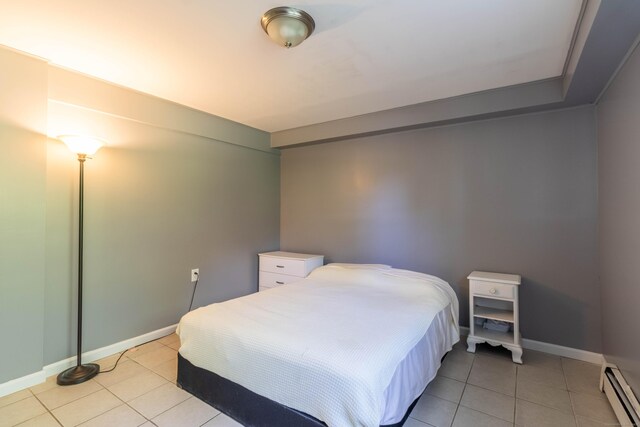 55 Linton St, Torrington, CT 06790 - bedroom featuring baseboard heating, light tile patterned floors, and baseboards