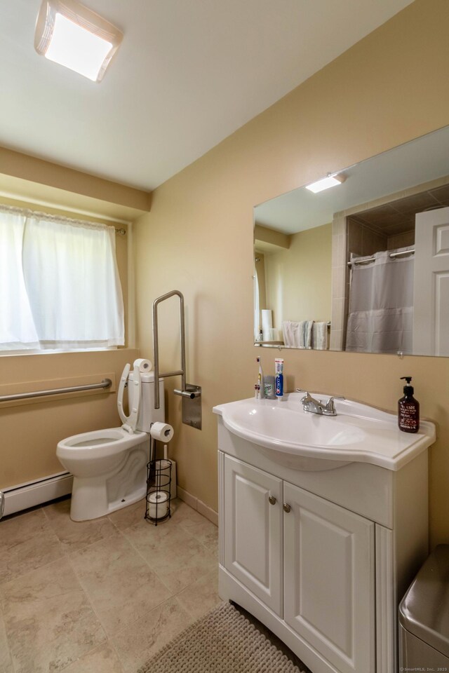55 Linton St, Torrington, CT 06790 - full bath featuring baseboard heating, toilet, vanity, baseboards, and a shower with shower curtain