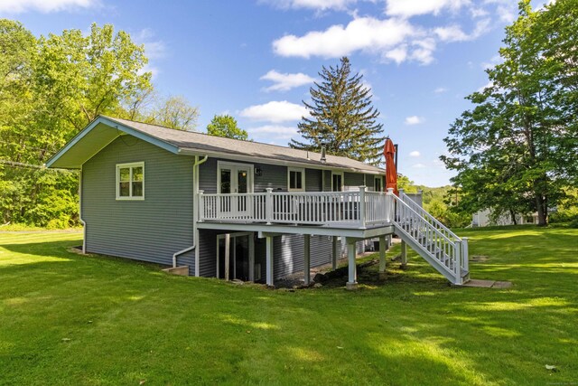 55 Linton St, Torrington, CT 06790 - back of property with a deck, a lawn, a chimney, and stairs