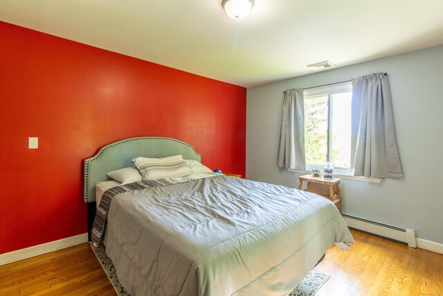 55 Linton St, Torrington, CT 06790 - bedroom with a baseboard radiator, wood finished floors, and baseboards