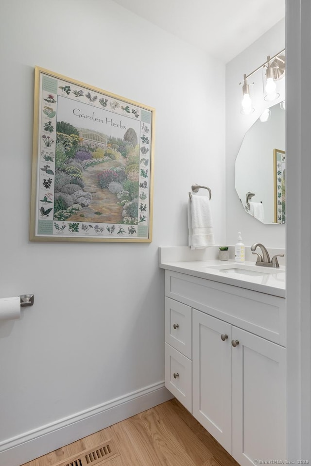 21 Summer Brook Way, Seymour, CT 06483 - bathroom with vanity, baseboards, and wood finished floors