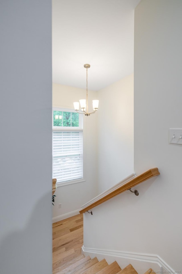 21 Summer Brook Way, Seymour, CT 06483 - stairway featuring a chandelier, wood finished floors, and baseboards