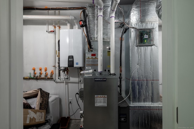 21 Summer Brook Way, Seymour, CT 06483 - utility room featuring tankless water heater