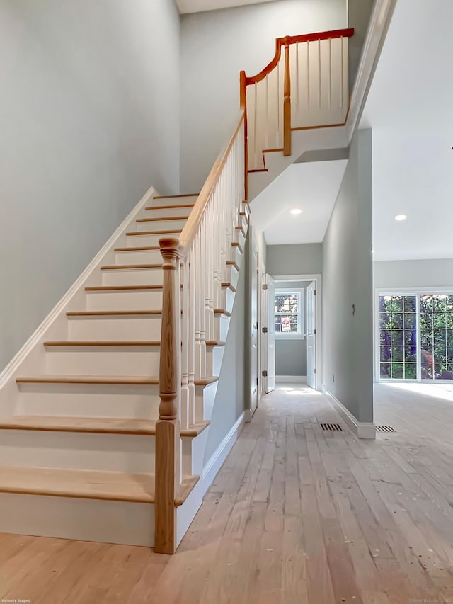 67 Fairfield Pl, Beacon Falls, CT 06403 - staircase featuring hardwood / wood-style flooring, baseboards, and recessed lighting