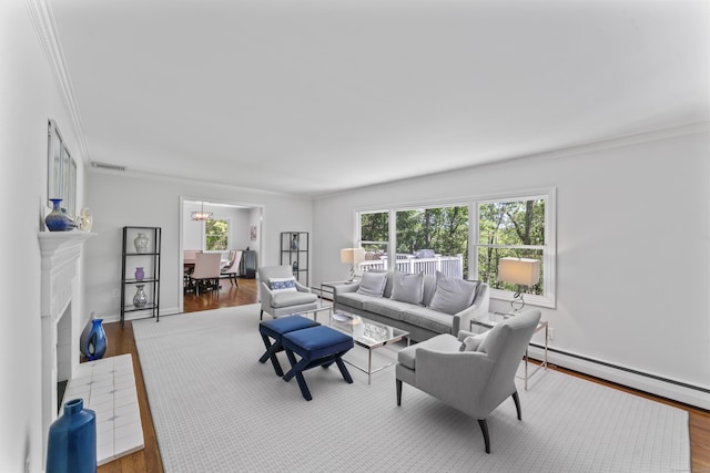 53 Pinnacle Rock Rd, Stamford, CT 06903 - living room with crown molding, wood finished floors, baseboard heating, a chandelier, and a fireplace