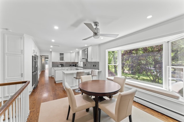 53 Pinnacle Rock Rd, Stamford, CT 06903 - dining room featuring a baseboard radiator, recessed lighting, ceiling fan, and wood finished floors