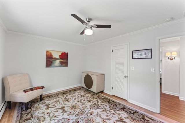 53 Pinnacle Rock Rd, Stamford, CT 06903 - sitting room with wood finished floors, ornamental molding, a ceiling fan, baseboards, and a baseboard heating unit