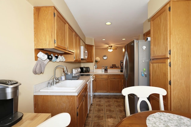 62 Deer Run Unit 62, Bethel, CT 06801 - kitchen featuring range with electric cooktop, a sink, white microwave, ceiling fan, and light countertops