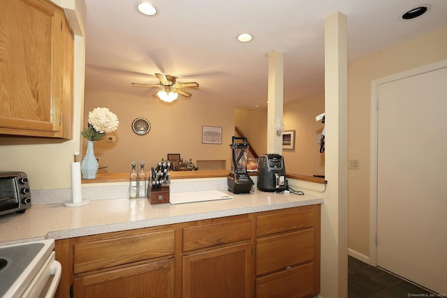 62 Deer Run Unit 62, Bethel, CT 06801 - kitchen featuring light countertops, recessed lighting, a ceiling fan, brown cabinets, and electric stove