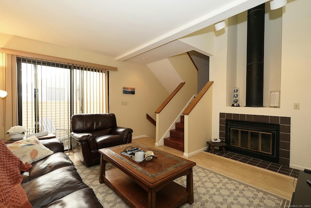 62 Deer Run Unit 62, Bethel, CT 06801 - living room with stairway, wood finished floors, baseboards, and a tile fireplace