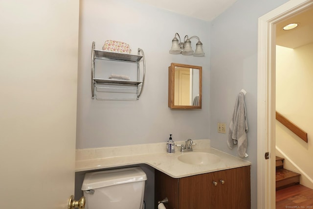 62 Deer Run Unit 62, Bethel, CT 06801 - half bathroom with toilet, vanity, and recessed lighting