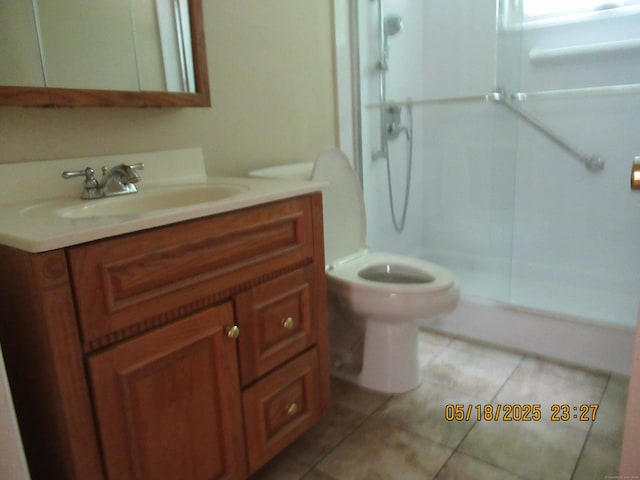 37 Stepney Cir, Rocky Hill, CT 06067 - full bath featuring a stall shower, vanity, tile patterned floors, and toilet