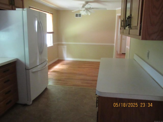 37 Stepney Cir, Rocky Hill, CT 06067 - kitchen featuring freestanding refrigerator, a ceiling fan, light flooring, and light countertops