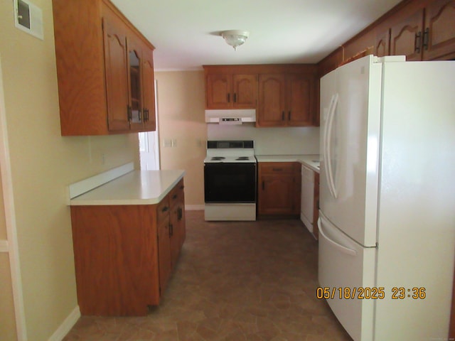 37 Stepney Cir, Rocky Hill, CT 06067 - kitchen featuring white appliances, exhaust hood, light countertops, and brown cabinetry