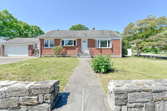 325 Lincoln Blvd, Bridgeport, CT 06606 - single story home with brick siding, asphalt driveway, a front yard, an attached garage, and a shingled roof