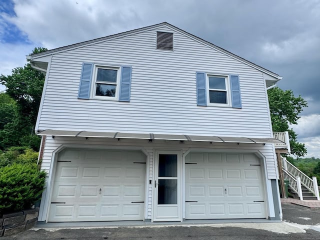 588 Poquonock Ave, Windsor, CT 06095 - view of home's exterior with stairway and an attached garage
