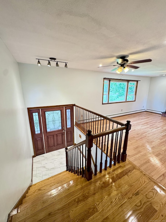 588 Poquonock Ave, Windsor, CT 06095 - entryway with a ceiling fan, baseboards, and a textured ceiling