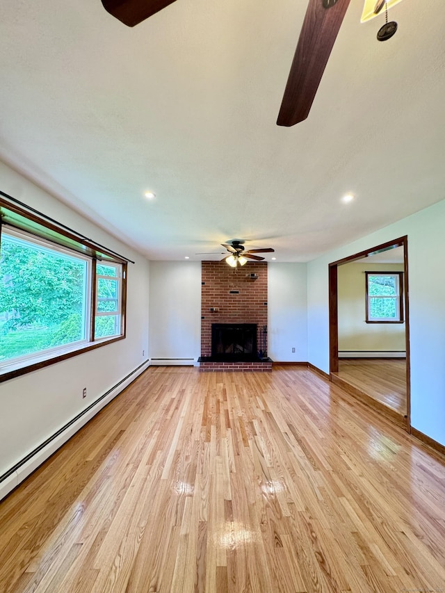 588 Poquonock Ave, Windsor, CT 06095 - unfurnished living room featuring ceiling fan, plenty of natural light, light wood-type flooring, a fireplace, and recessed lighting