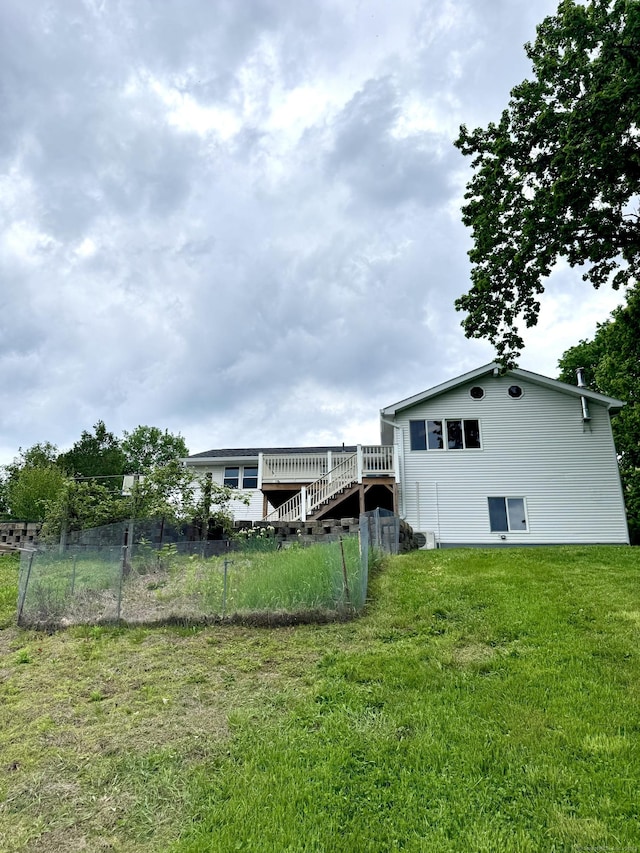 588 Poquonock Ave, Windsor, CT 06095 - rear view of property featuring a lawn, a deck, and stairs