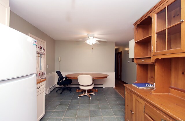 179 N Moodus Rd, East Haddam, CT 06469 - dining space featuring tile patterned floors, a baseboard heating unit, and a ceiling fan