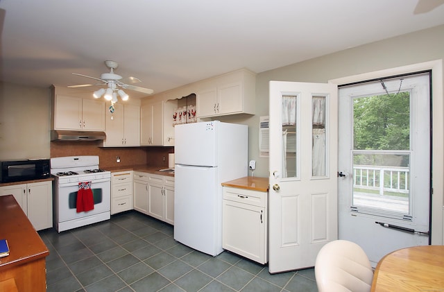 179 N Moodus Rd, East Haddam, CT 06469 - kitchen featuring white appliances, under cabinet range hood, ceiling fan, dark tile patterned flooring, and white cabinets