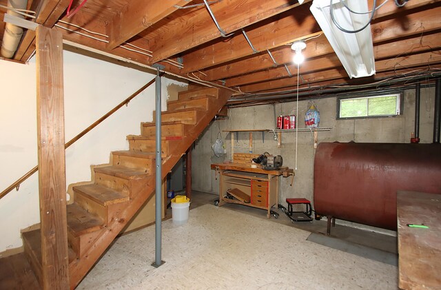 179 N Moodus Rd, East Haddam, CT 06469 - basement featuring oil tank, stairs, and a workshop area