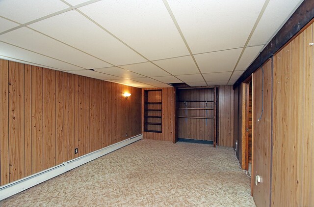 179 N Moodus Rd, East Haddam, CT 06469 - finished below grade area with a baseboard radiator, wooden walls, a paneled ceiling, and carpet floors